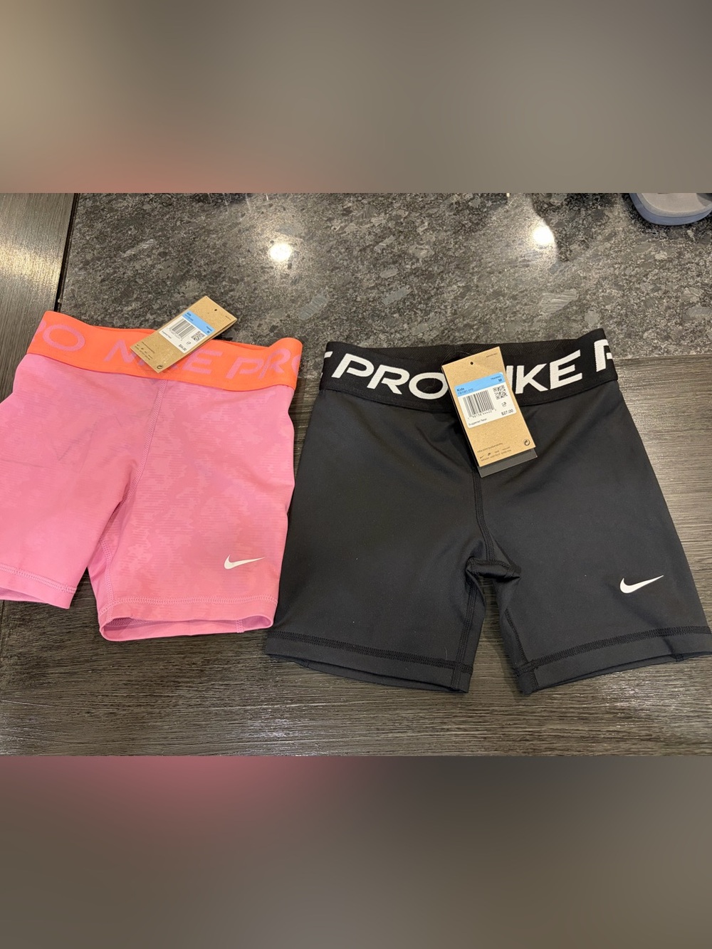2 pairs, Nike Pro Kids Pink and black shorts